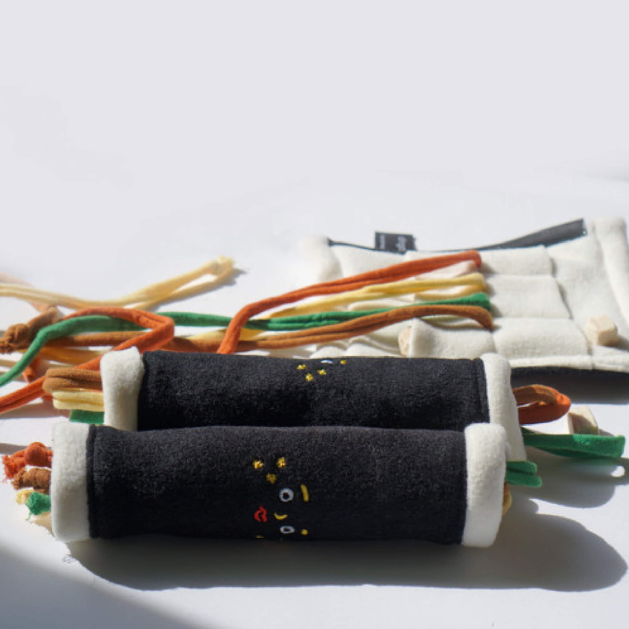 Strings and places for snack inside the regular gimbap nosework toy.
