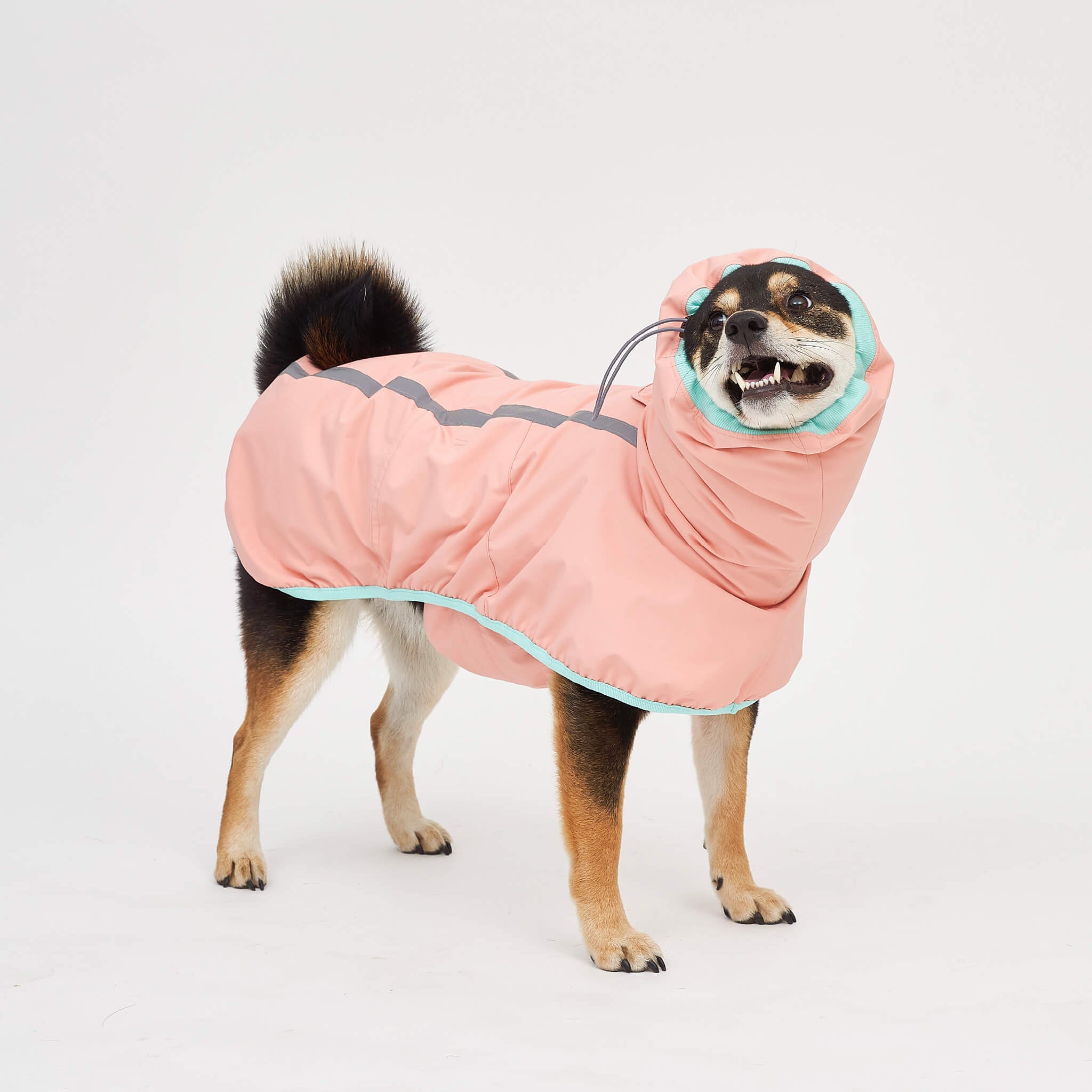 Rain coat in strawberry. Model is wearing a 3L.