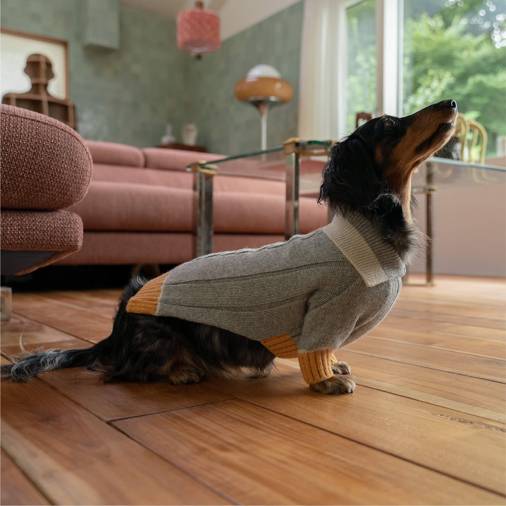 DOKT cashmere knit in grey and yellow. Model is wearing a L.