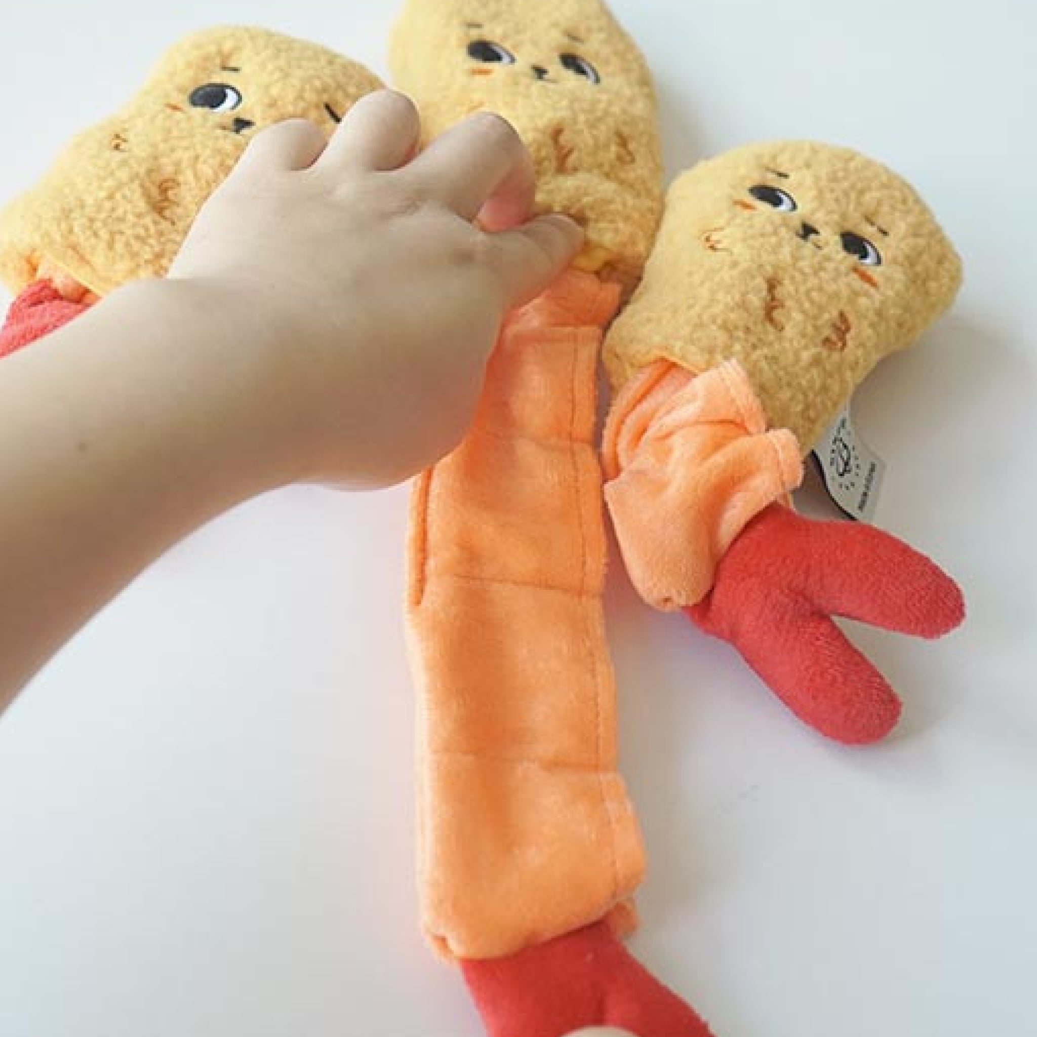 The fried shrimp nosework toy has a stretchy nosework insert.