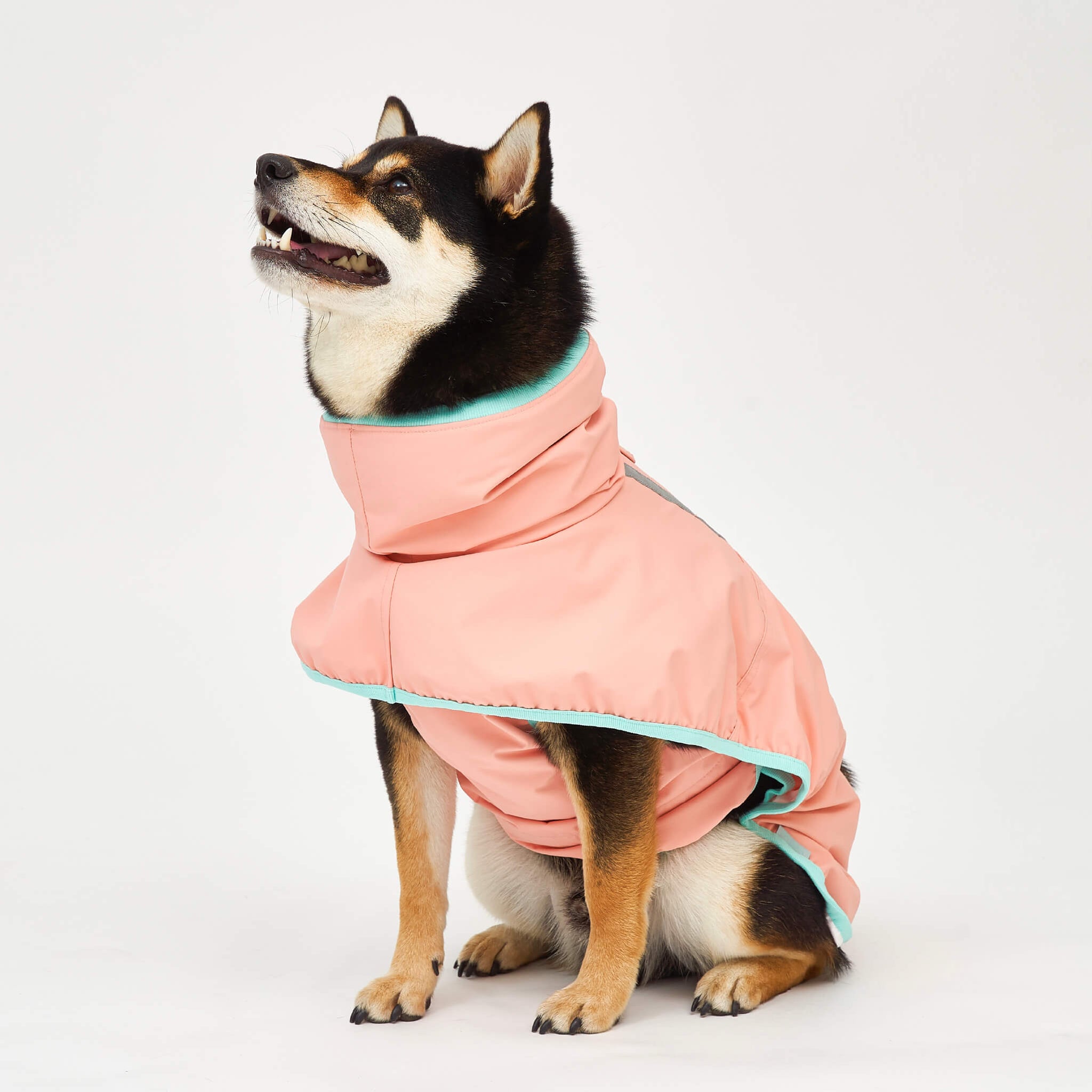 Rain coat in strawberry. Model is wearing a 3L.