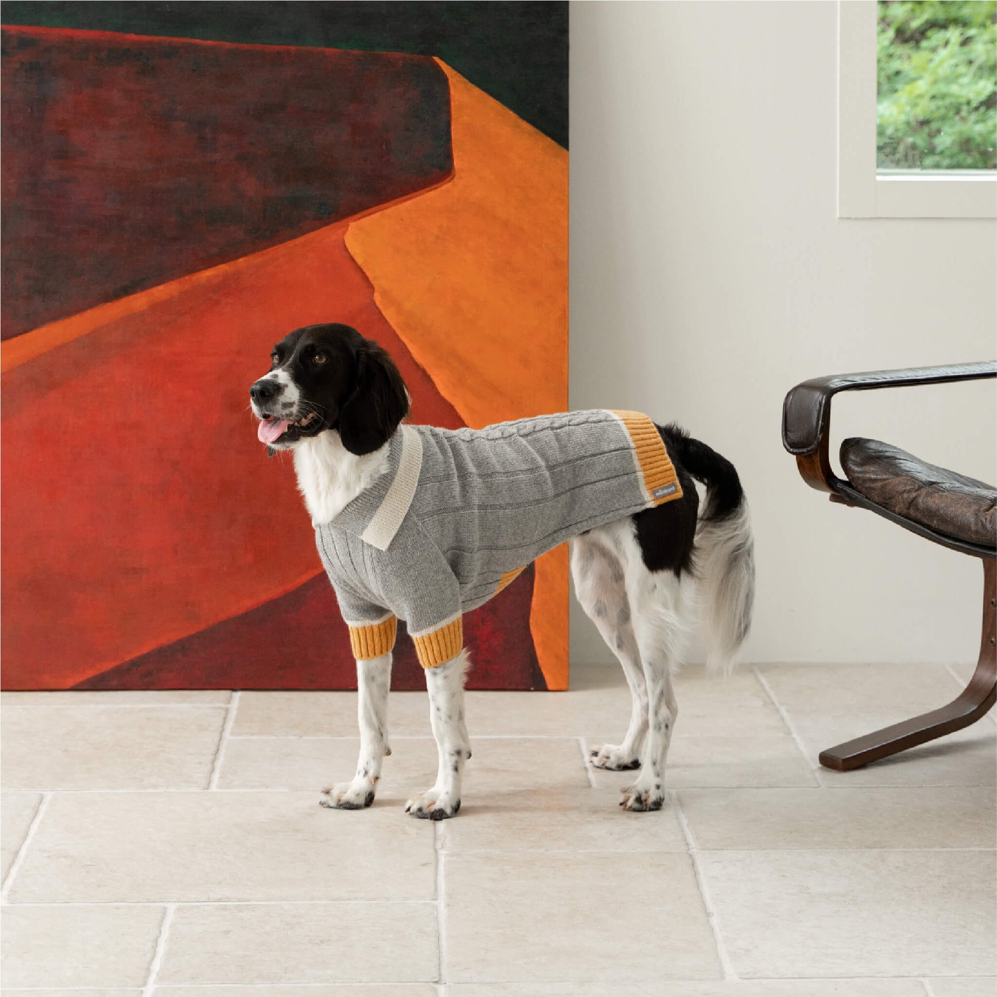 DOKT cashmere knit in grey and yellow. Model is wearing a 3L.
