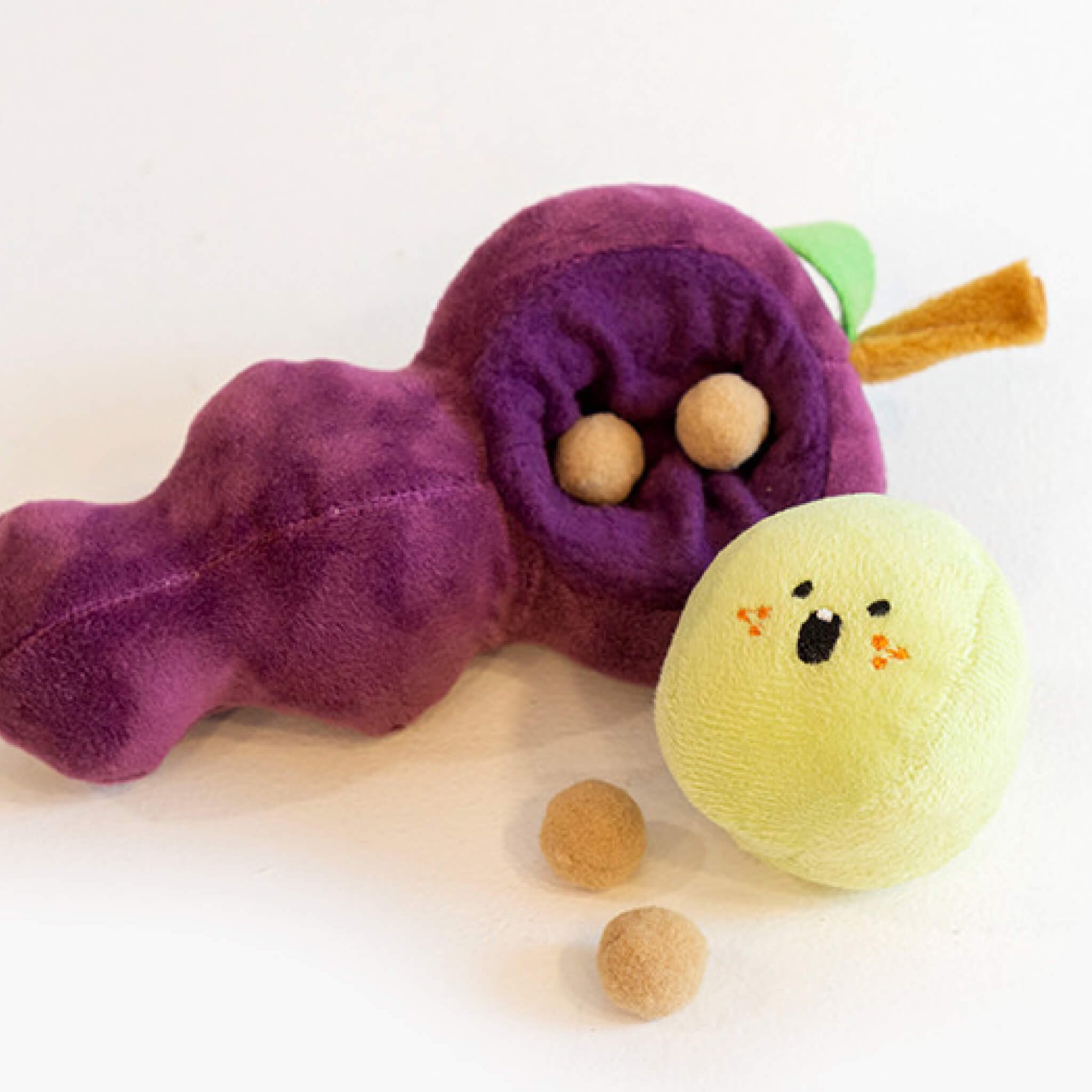Place snacks inside the grape hole and place the grape over it.