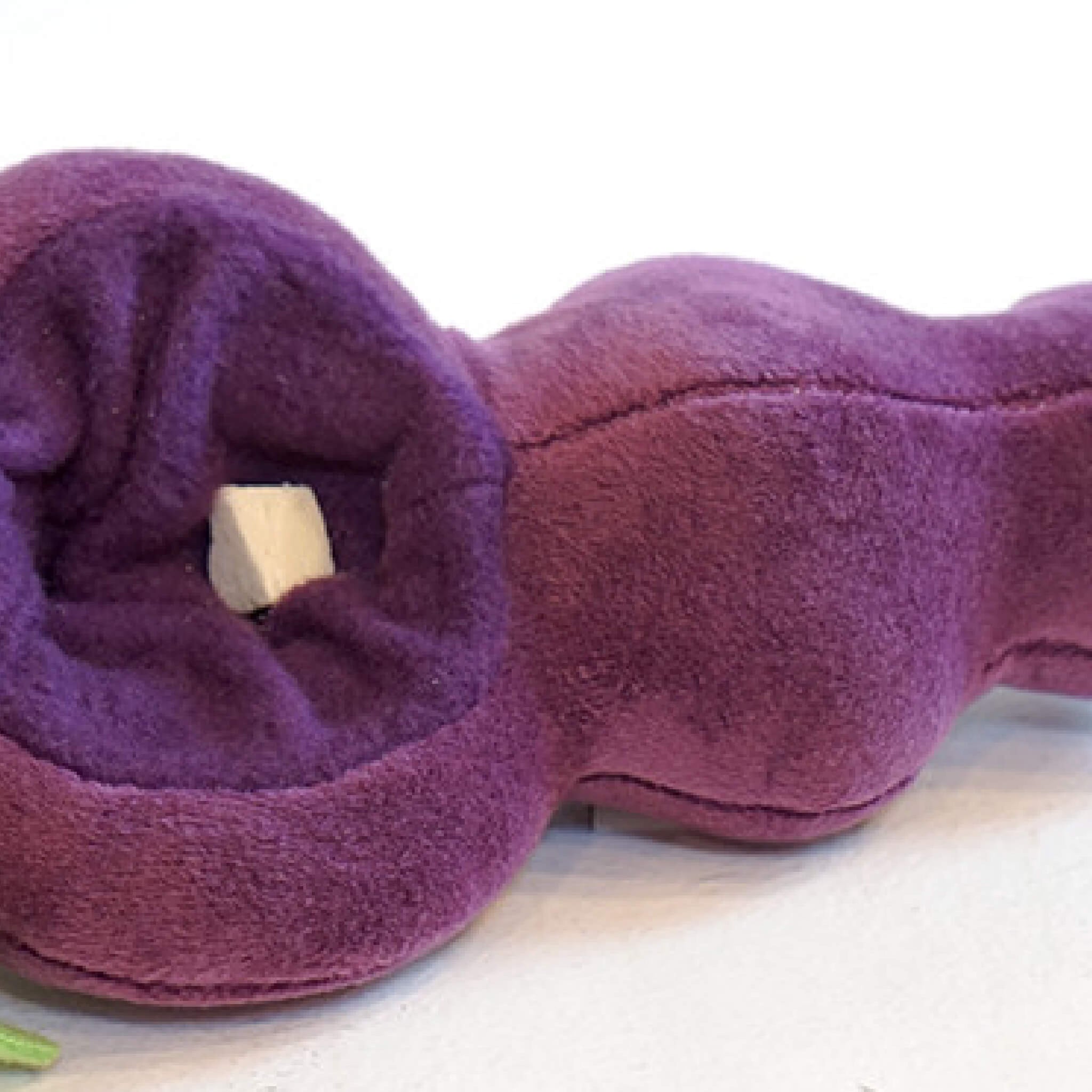 Place snacks or treats inside the grape hole.